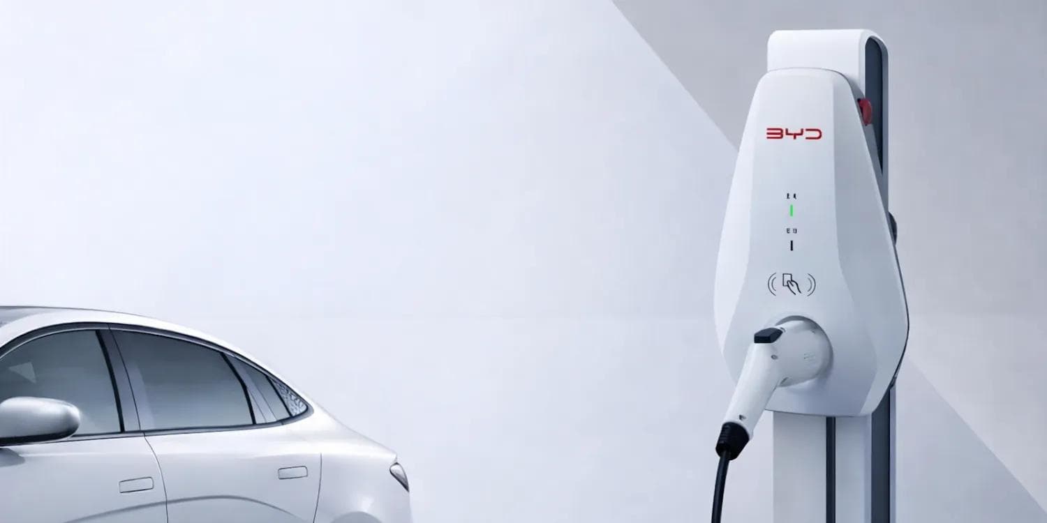BYD electric vehicle connected to a home charging station with smartphone app displaying sharing options BYD electric vehicle connected to a home charging station with smartphone app displaying sharing options