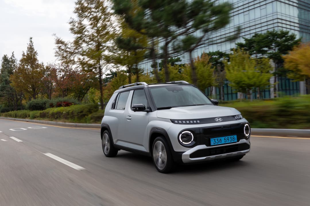 Blue MG ZS EV electric SUV driving Blue MG ZS EV electric SUV driving